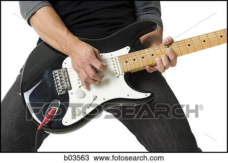 Portrait of young man playing electric guitar View Large Photo Image Stock Image - Portrait of young man playing electric guitar. Fotosearch