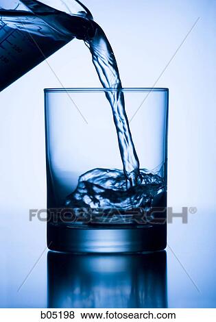 Pouring water into a glass View Large Photo Image Stock Photo - Pouring water into a glass. Fotosearch