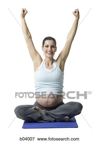 Pregnant woman doing yoga View Large Photo Image Stock Photo - Pregnant woman doing yoga. Fotosearch