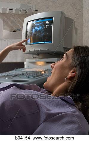 Pregnant woman having an ultrasound View Large Photo Image Picture - Pregnant woman having an ultrasound. Fotosearch