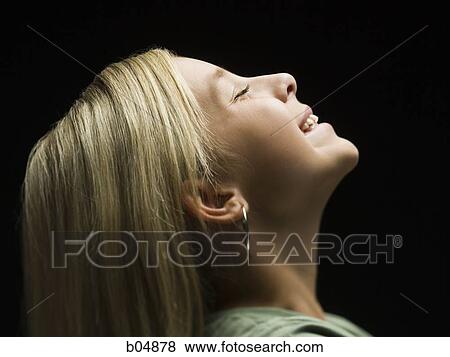Profile of girl smiling with closed eyes View Large Photo Image Stock Photo - Profile of girl smiling with closed eyes. Fotosearch