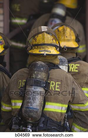 Rear View of fire fighters View Large Photo Image Stock Photo - Rear View of fire fighters. Fotosearch