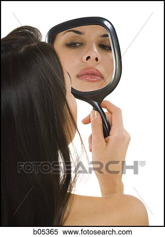 Reflection of woman in hand mirror View Large Photo Image Stock Photography - Reflection of woman in hand mirror. Fotosearch