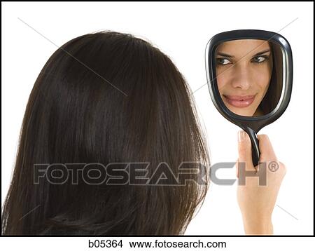 Reflection of woman smiling in hand mirror View Large Photo Image Picture - Reflection of woman smiling in hand mirror. Fotosearch