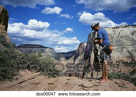 Rock climber standing View Large Photo Image Stock Photo - Rock climber standing. Fotosearch