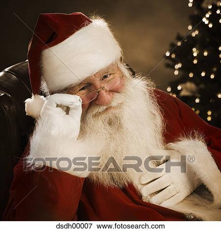 Santa Claus sitting down View Large Photo Image Stock Photo - Santa Claus sitting down. Fotosearch