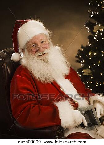 Santa Claus sitting down View Large Photo Image Stock Photo - Santa Claus sitting down. Fotosearch