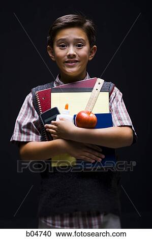 Schoolboy with supplies and red apple View Large Photo Image Stock Image - Schoolboy with supplies and red apple. Fotosearch