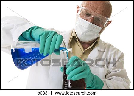 Scientist pouring chemicals into beaker View Large Photo Image Stock Image - Scientist pouring chemicals into beaker. Fotosearch