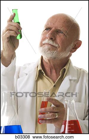 Scientist with chemicals in test tubes and beakers View Large Photo Image Stock Photo - Scientist with chemicals in test tubes and beakers. Fotosearch