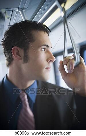 Side profile of businessman on city bus or subway View Large Photo Image Stock Photography - Side profile of businessman on city bus or subway. Fotosearch