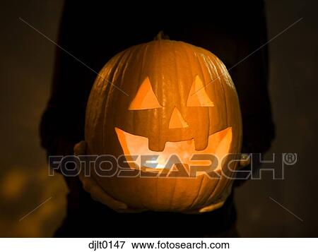 Silhouette of man with jack o'lantern View Large Photo Image Stock Photo - Silhouette of man with jack o'lantern. Fotosearch