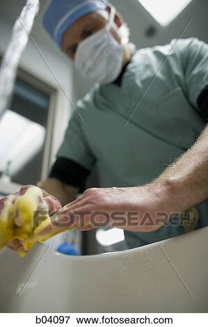 Surgeon washing his hands View Large Photo Image Stock Photo - Surgeon washing his hands. Fotosearch