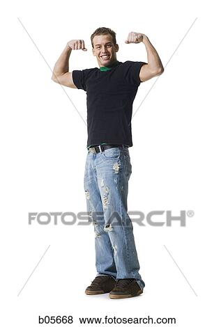 Teenage boy flexing View Large Photo Image Stock Photo - Teenage boy flexing. Fotosearch