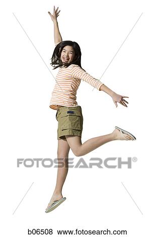 Stock Photo - Teenage girl jumping. Fotosearch