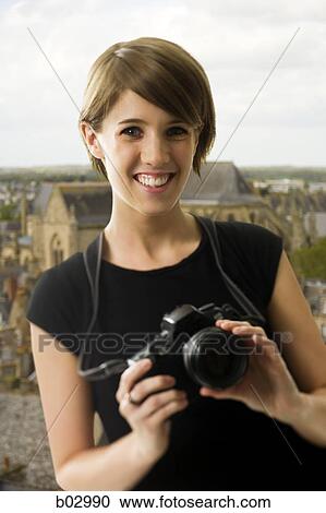 Teenage girl with a camera View Large Photo Image Stock Image - Teenage girl with a camera. Fotosearch