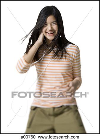 Teenage girl with an MP3 player View Large Photo Image Stock Image - Teenage girl with an MP3 player. Fotosearch