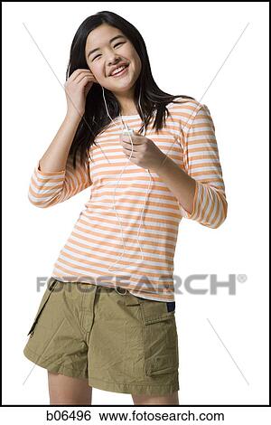 Teenage girl with an MP3 player View Large Photo Image Stock Photograph - Teenage girl with an MP3 player. Fotosearch