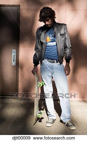Stock Photo - Teenager with skateboard. Fotosearch