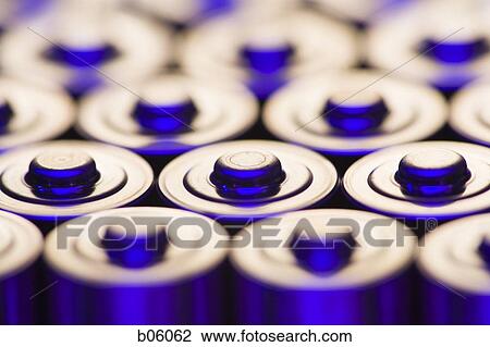 Stock Image - The tops of alkaline batteries. Fotosearch