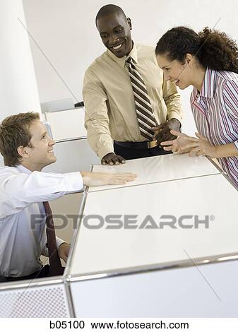 Three coworkers talking View Large Photo Image Stock Image - Three coworkers talking. Fotosearch