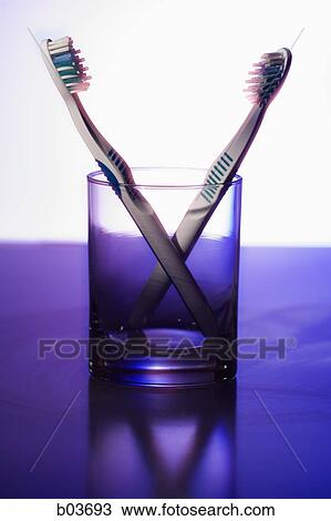 Toothbrushes in glass View Large Photo Image Stock Image - Toothbrushes in glass. Fotosearch