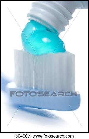 Toothpaste being applied to toothbrush View Large Photo Image Stock Photo - Toothpaste being applied to toothbrush. Fotosearch