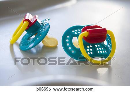 Two baby pacifiers View Large Photo Image Stock Photography - Two baby pacifiers. Fotosearch
