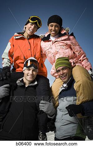 Two couples outside in the snow View Large Photo Image Stock Image - Two couples outside in the snow. Fotosearch