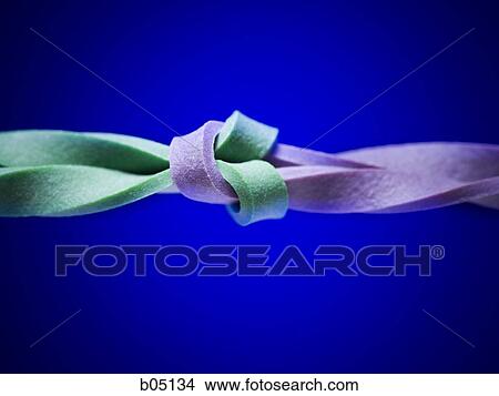 Two elastic bands intertwined View Large Photo Image Picture - Two elastic bands intertwined. Fotosearch