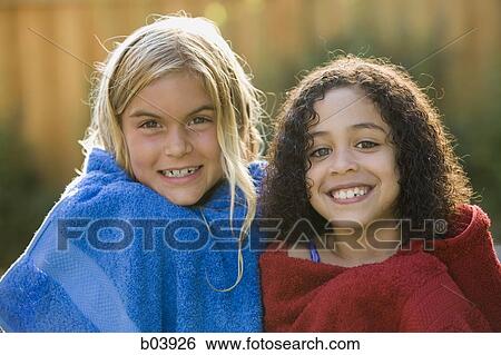 Two female children wrapped in towels View Large Photo Image Stock Photograph - Two female children wrapped in towels. Fotosearch