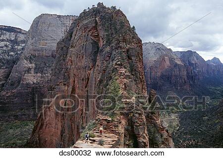 Stock Image - Two people on top of mountain. Fotosearch