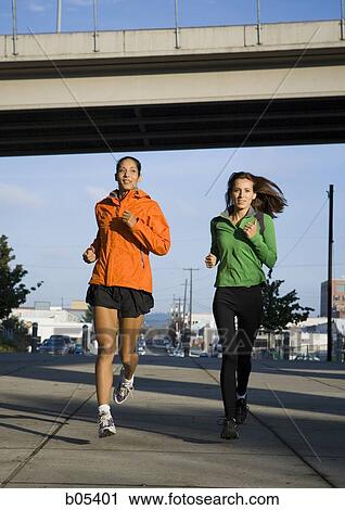 Two women jogging View Large Photo Image Stock Image - Two women jogging. Fotosearch