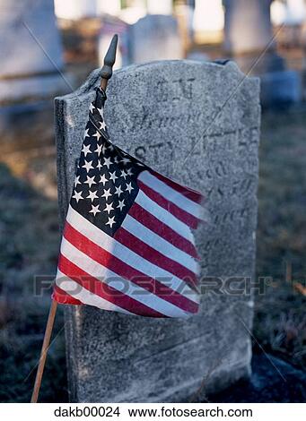 Picture - USA flag beside headstone. Fotosearch