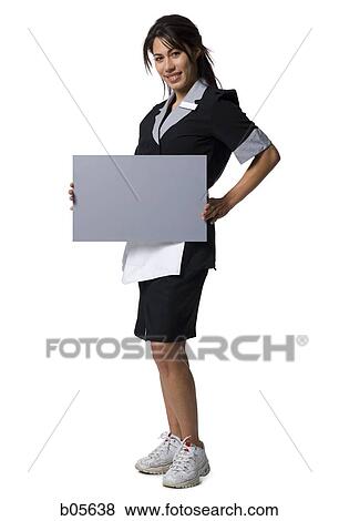 Waitress in uniform with blank sign View Large Photo Image Stock Photo - Waitress in uniform with blank sign. Fotosearch