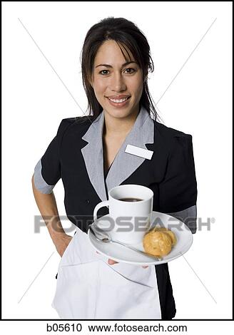 Waitress with coffee and biscuits smiling View Large Photo Image Stock Image - Waitress with coffee and biscuits smiling. Fotosearch