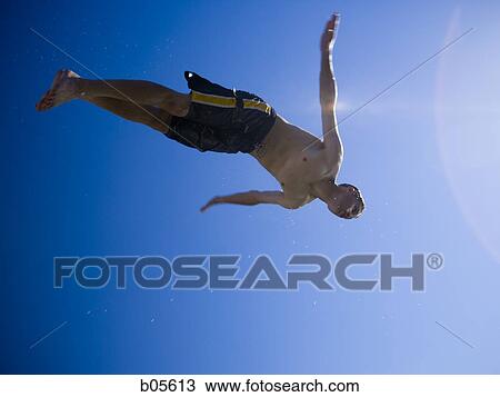 Wet teenage boy diving View Large Photo Image Stock Image - Wet teenage boy diving. Fotosearch