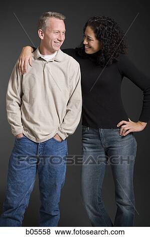 Woman and man embracing View Large Photo Image Stock Photo - Woman and man embracing. Fotosearch