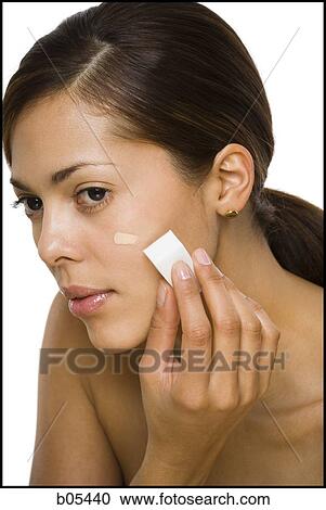 Woman applying foundation with makeup sponge View Large Photo Image Stock Image - Woman applying foundation with makeup sponge. Fotosearch