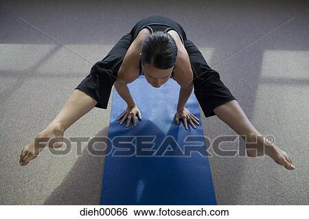 Woman balancing on her hands View Large Photo Image Stock Photograph - Woman balancing on her hands. Fotosearch