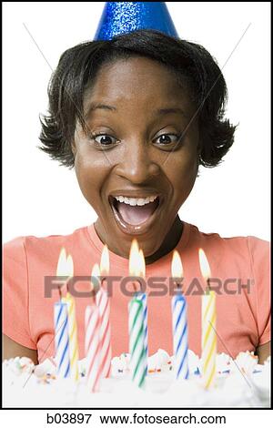Woman blowing out birthday candles View Large Photo Image Stock Photo - Woman blowing out birthday candles. Fotosearch