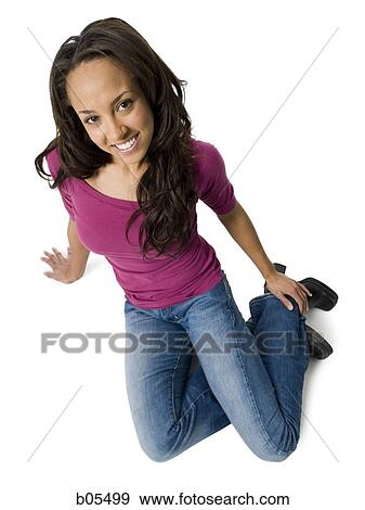 Woman casually dressed looking up View Large Photo Image Stock Photo - Woman casually dressed looking up. Fotosearch