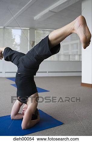 Woman doing yoga View Large Photo Image Picture - Woman doing yoga. Fotosearch
