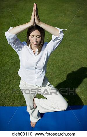 Stock Image - Woman doing yoga. Fotosearch