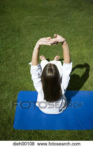 Woman doing yoga View Large Photo Image Stock Photo - Woman doing yoga. Fotosearch