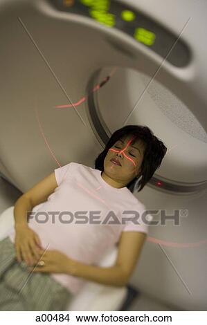 Woman entering MRI machine View Large Photo Image Picture - Woman entering MRI machine. Fotosearch