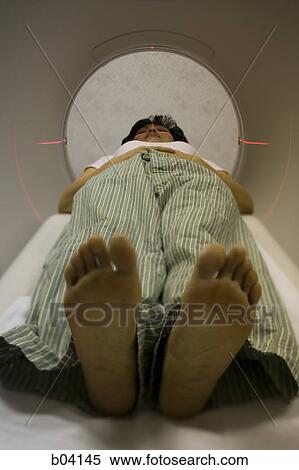 Stock Photography - Woman entering MRI machine. Fotosearch