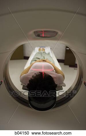 Stock Image - Woman having an MRI. Fotosearch