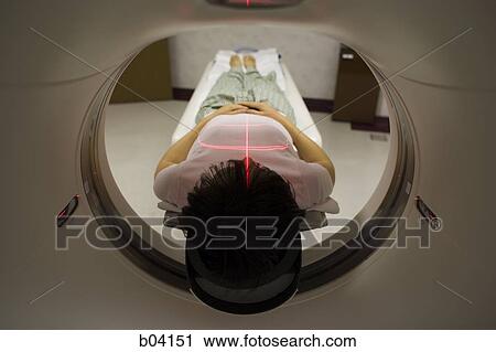 Stock Image - Woman having an MRI. Fotosearch