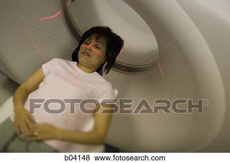 Woman having an MRI View Large Photo Image Stock Photo - Woman having an MRI. Fotosearch